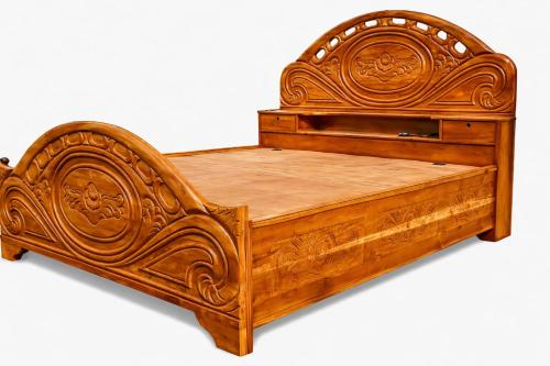 a wooden bed with a carved wooden frame and drawer at Hotel Nirmalai Palace Mahur in Māhūr