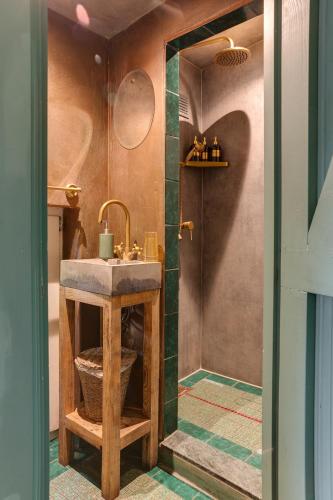 a bathroom with a sink and a shower at BoHo Experience Wellness, Jacuzzi, Sauna, BBQ, Garden, Sleeps 10 in Kockengen
