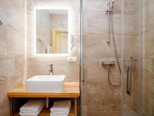 a bathroom with a sink and a shower at Golden Apartments - Villa Taternik - Studio with balcony in Zakopane