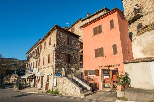 a group of buildings on the side of a street at Locanda del Borgo in Todi
