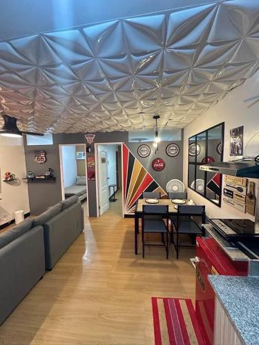 a living room with a couch and a table at Retro Themed Condominium Staycation in Marilao