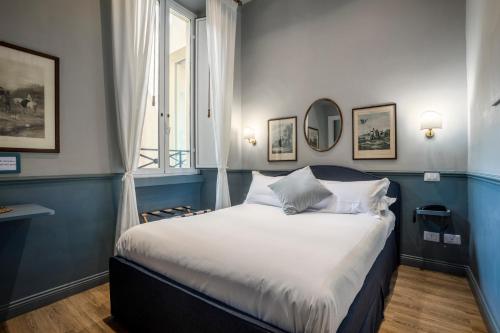 En eller flere senge i et værelse på Hotel donna Francesca