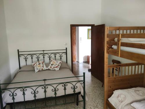 a bedroom with a bed and two bunk beds at A due passi dal mare in Praia a Mare
