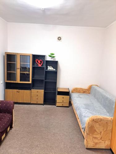 a room with a bed and a dresser in it at Квартира Шевченка in Lutsk