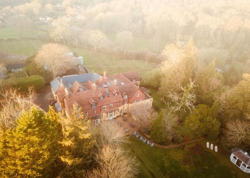 an aerial view of a large house in a field at Moorhill House Hotel in Burley