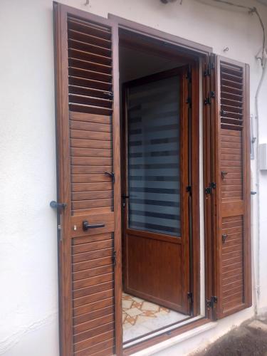 an open wooden door of a building at Casa Maria Naxos in Giardini Naxos