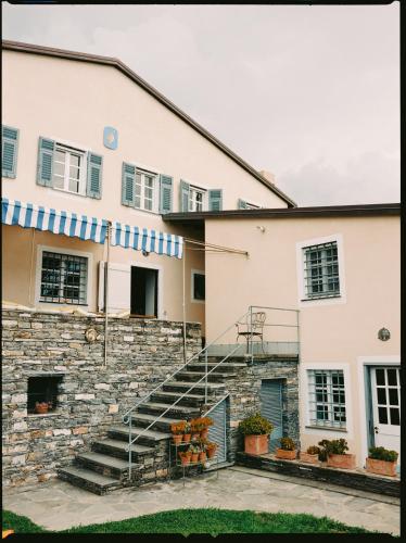a building with stairs in front of it at Casa Pernice in Lavagna