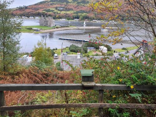 a view of a river from a wooden fence at Croftbank in Lochranza