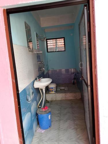 a bathroom with a sink and a toilet in it at B N Hotel & Restaurant in Rāmechhāp