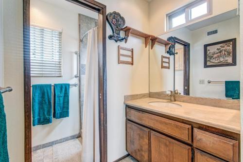a bathroom with a sink and a shower at Catch some waves! Panoramic ocean views!- Cardiff Surfer in Cardiff-by-the-Sea