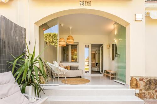 a living room with an archway in a house at Casa Tucan Javea, luxury close to Arenal Beach in Jávea