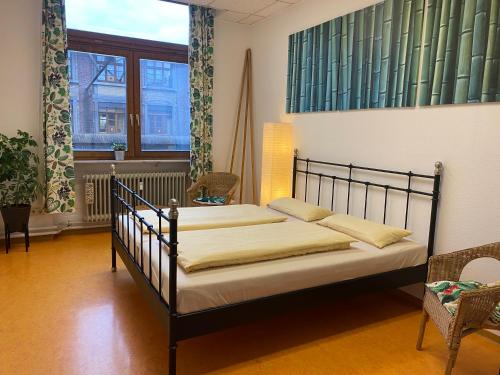 a bedroom with a bed in a room at Steffis Hostel Heidelberg in Heidelberg