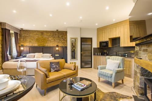 a bedroom with a bed and a living room at Just us Two - North East Escapes in Amble