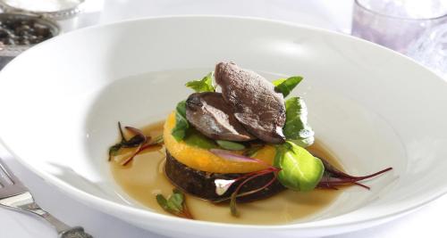 a white bowl filled with a dish of food at Invercarse Hotel Dundee, BW Signature Collection in Dundee