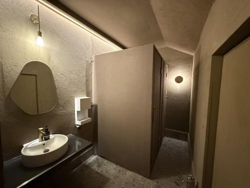 a bathroom with a sink and a mirror at Render Fika Sammu in Sanmu