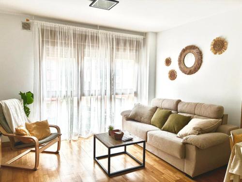 a living room with a couch and a table at El Descanso del Cares in Arenas de Cabrales