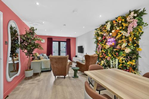 a room with a large wall of flowers at Central Belfast Apartments: Citygate in Belfast