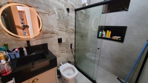 a bathroom with a shower and a toilet and a sink at Casa Tecnoshow 2026 in Rio Verde