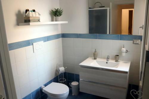 a bathroom with a sink and a toilet at Sunset House in Anzio