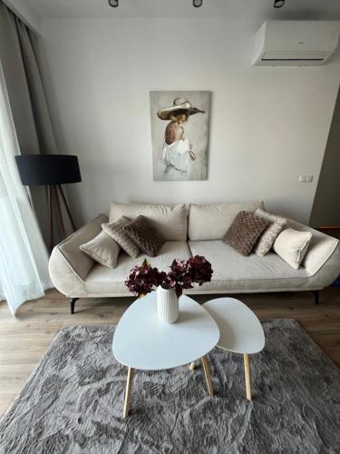 a living room with a couch and a table at SPV Rentals Premium Apartament Wołoska 3 in Warsaw