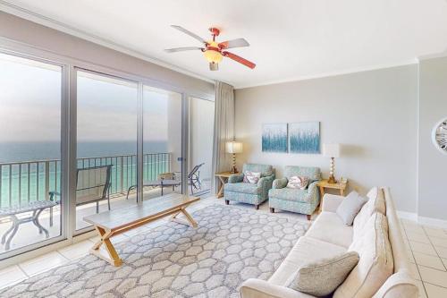 a living room with a couch and a view of the ocean at Gulf-Front Condo with Pools and Gym in Destin