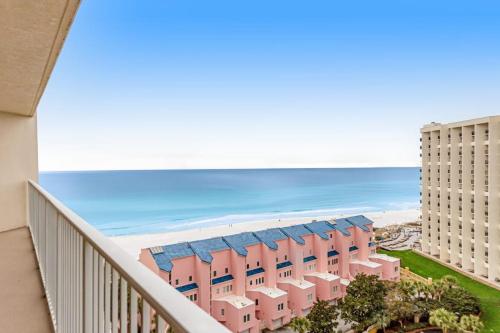 a view of the beach from the balcony of a resort at Relaxing Waterfront Condo with Pools & Gym Access in Destin