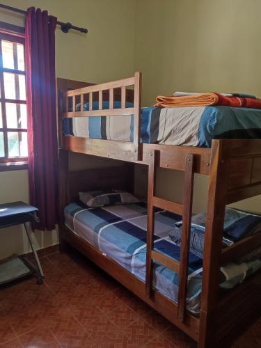 a pair of bunk beds in a room at Gästehaus Samaipata in Samaipata