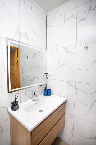 a bathroom with a sink and a mirror at Casa Irazú in Cartago