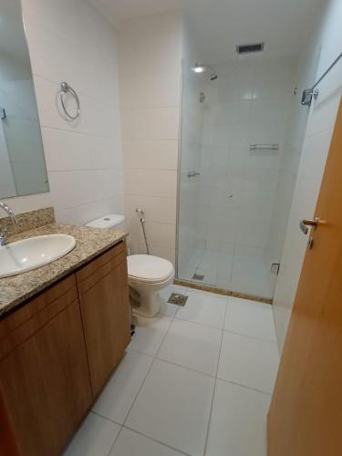 a bathroom with a shower and a toilet and a sink at Flat Particular Marizienne Hotel Saint Moritz 86 in Brasília