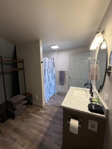 a bathroom with a sink and a shower at Bryce Glamp And Camp in Cannonville