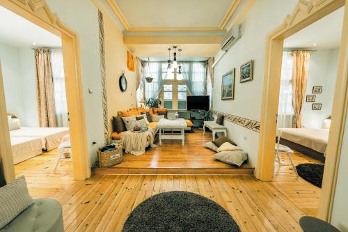 a living room with a couch and a table at TOMOVI HOME - Three bedrooms City center in Plovdiv