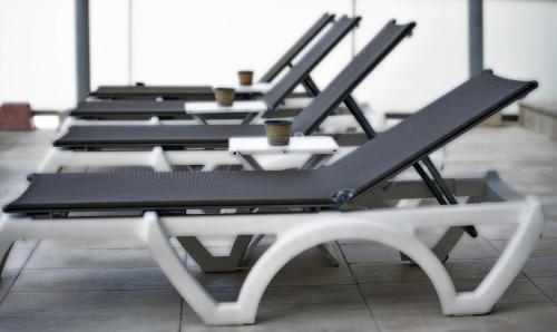 a row of empty chairs sitting in a room at Hotel Nadal in Benidorm