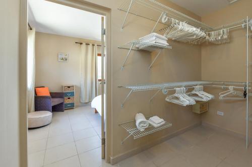 a walk in closet with shelves in a room at Arantxa Residence in Noord