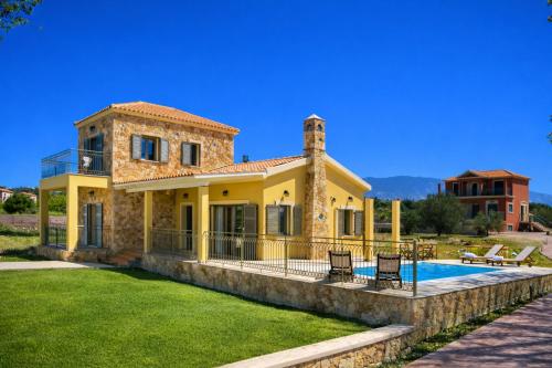 a house with a pool in front of it at Estrellas Luxury Villas in Svoronata