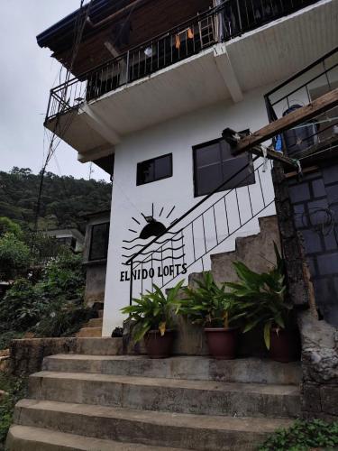 a building with a spider on the side of it at El Nido Lofts in El Nido