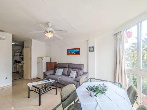 a living room with a couch and a table at Apartment Turia Playa by Interhome in Benidorm