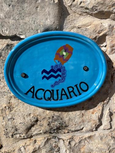 a blue frisbee sitting on a stone wall at Trullo Acquario in Castellana Grotte