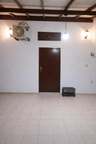 an empty room with a door and a basketball hoop at Robert's-stay in Katunayaka