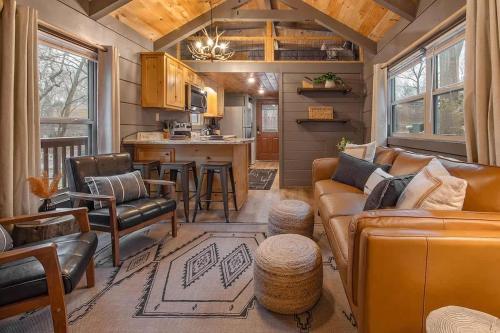 a living room and kitchen in a tiny house at Gabriele Cabin Rustic Retreat Near Downtown in Chattanooga
