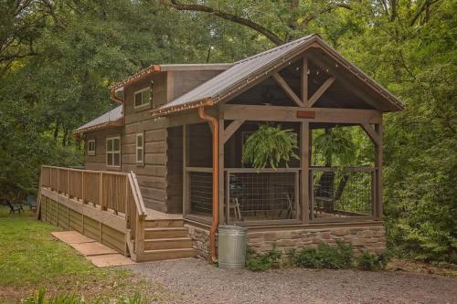 a log cabin with a porch and a gazebo at Celina Cabin Nature Cabin Near Downtown Chattanooga in Chattanooga