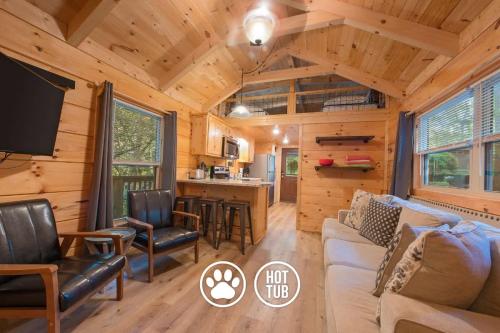 a living room and kitchen in a log cabin at Celina Cabin Nature Cabin Near Downtown Chattanooga in Chattanooga