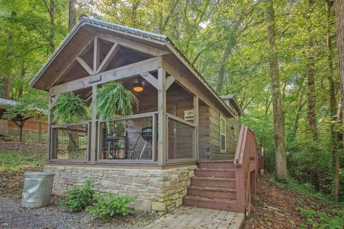 a tiny house in the woods with a porch at Apollonie Cabin Lookout Mountain Hot Tub in Chattanooga