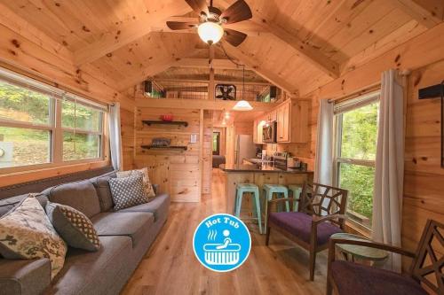 a living room and kitchen in a tiny house at Apollonie Cabin Lookout Mountain Hot Tub in Chattanooga