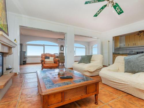 a living room with a couch and a coffee table at Holiday Home Floramar by Interhome in Lloret de Mar