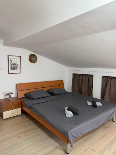 a bedroom with a bed in a attic at Villa Fantasy Premium Lakeview in Ohrid