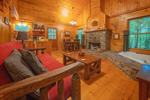 a living room with a couch and a fireplace at Cherokee Ridge Cabin Near The Ocoee River in Ocoee