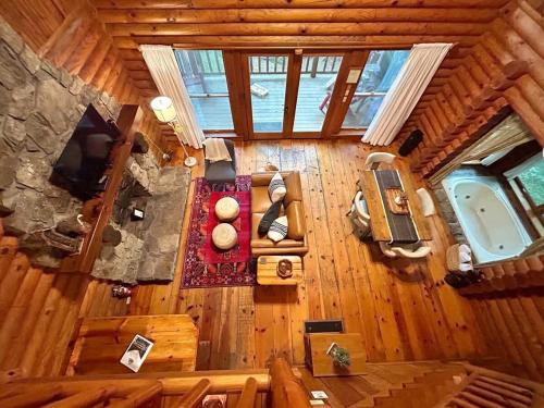 an overhead view of a living room in a log cabin at Ocoee Cabin Beautiful Cabin On The River's Edge in Ocoee