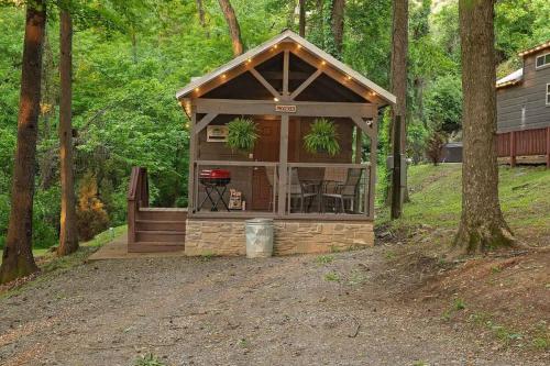 a small cabin in the middle of the woods at Tiny Cabin Village Private Hot Tub Lynda Cabin in Chattanooga