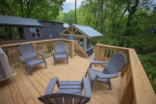 a wooden deck with four chairs and a gazebo at Jake Cabin Luxury Hot Tub Cabin Near Downtown in Chattanooga