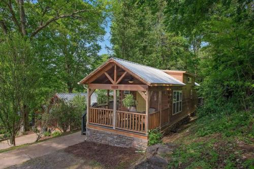 a house with a gazebo in the woods at Elise Cabin Forest Retreat 5 Mins To Downtown in Chattanooga